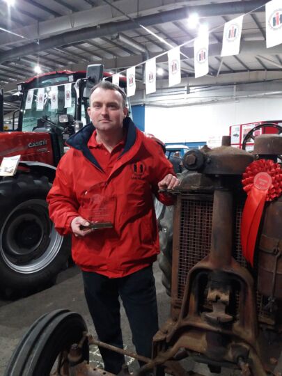 This image has an empty alt attribute; its file name is 20190324_115338-Ian-with-Farmall-405x540.jpg